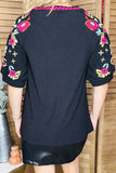 Fuchsia trim & floral embroidery black women top XCH16344